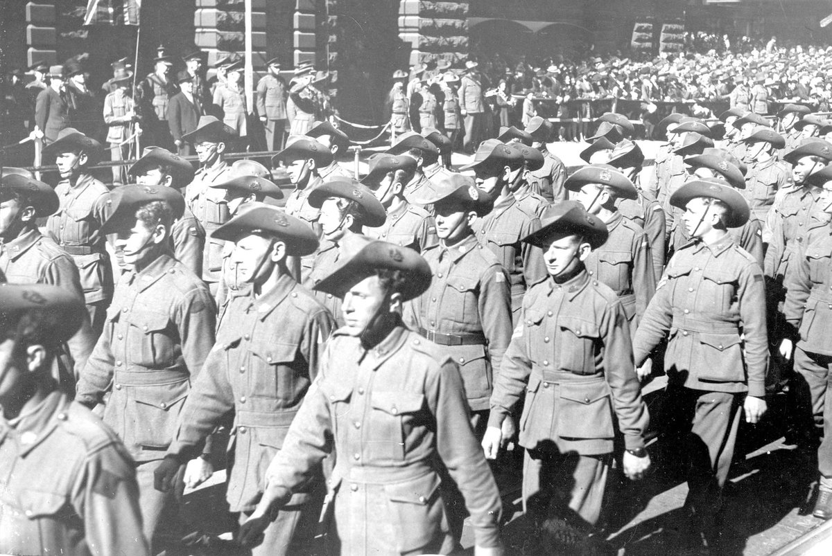 Australian servicemen marching past the saluting base outside the Melbourne Town Hall, Swanston Street, Melbourne, Melbourne City (1940–45)