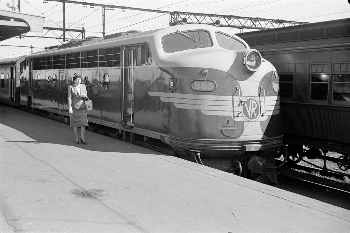 Victorian Railways country train at platform in station, Melbourne, Victoria (1953)