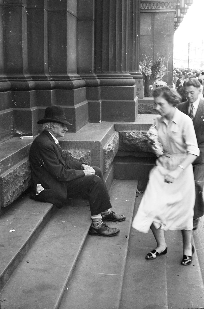 Men sitting on steps of the G.P.O., Melbourne, Melbourne City (1954)