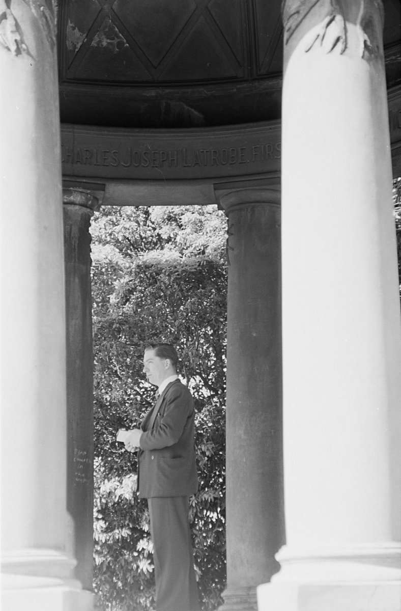 Man standing between the pillars of the Temple of the Winds in Royal Botanic Gardens, Melbourne, Melbourne City (1954)
