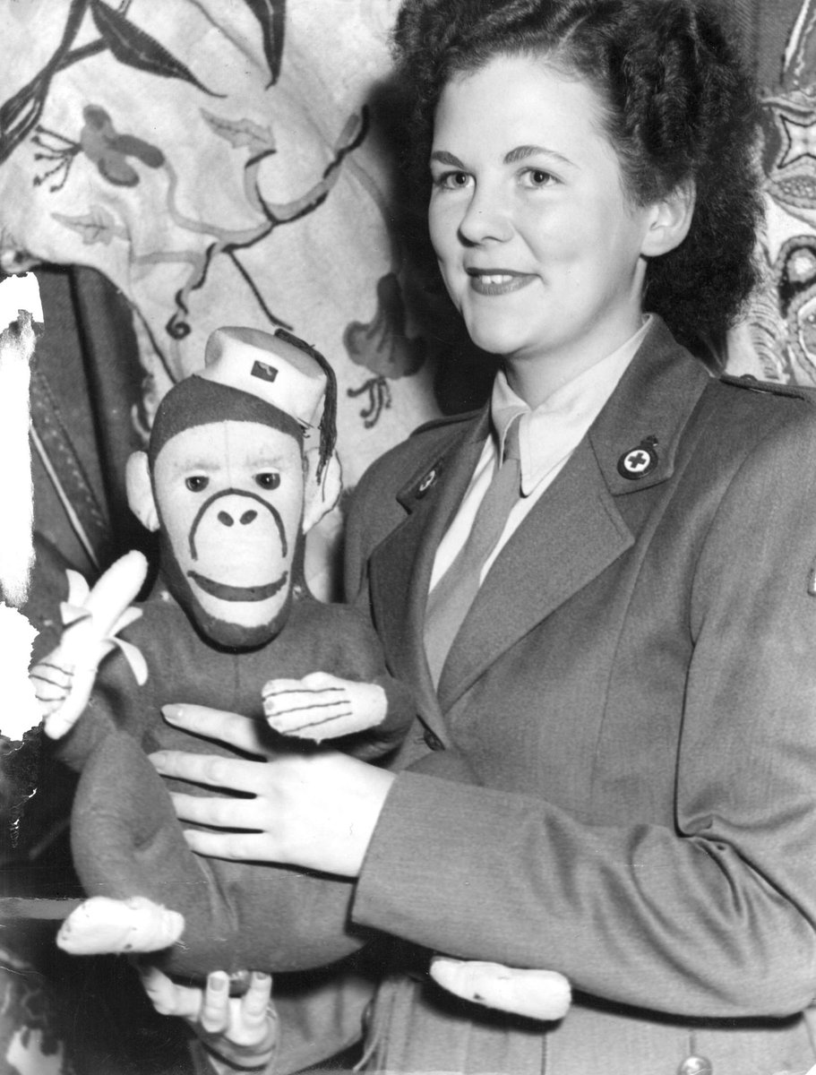 Miss JUDY ROBERTS displays some of the work done by servicemen at Red Cross Display, [Melbourne Town Hall], Melbourne City (c. 1946)