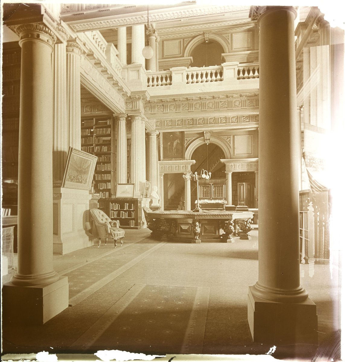 Interior of the Parliamentary Library, showing reading desk and some shelves, Melbourne (1880–1938)