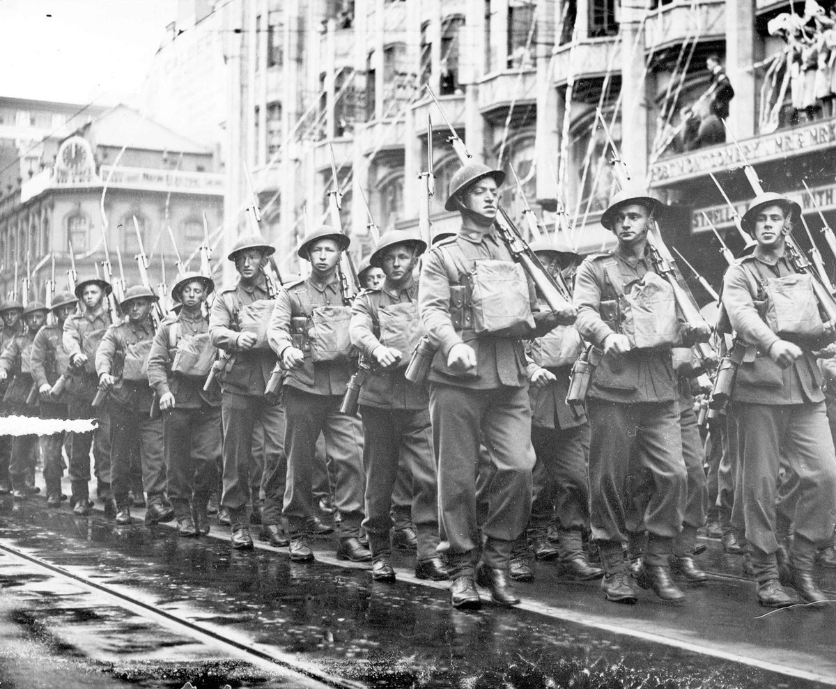Streamers falling over 2nd A.I.F. marching on Swanston Street, Melbourne City (1939–44)