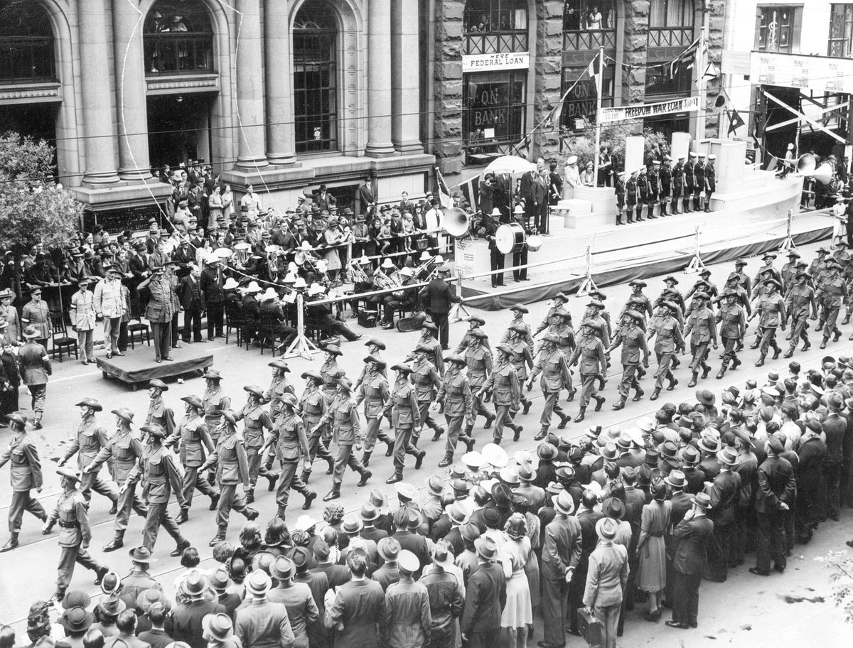 Armed servicemen marching past the National Bank, Collins Street, Melbourne, Melbourne City (1940–45)