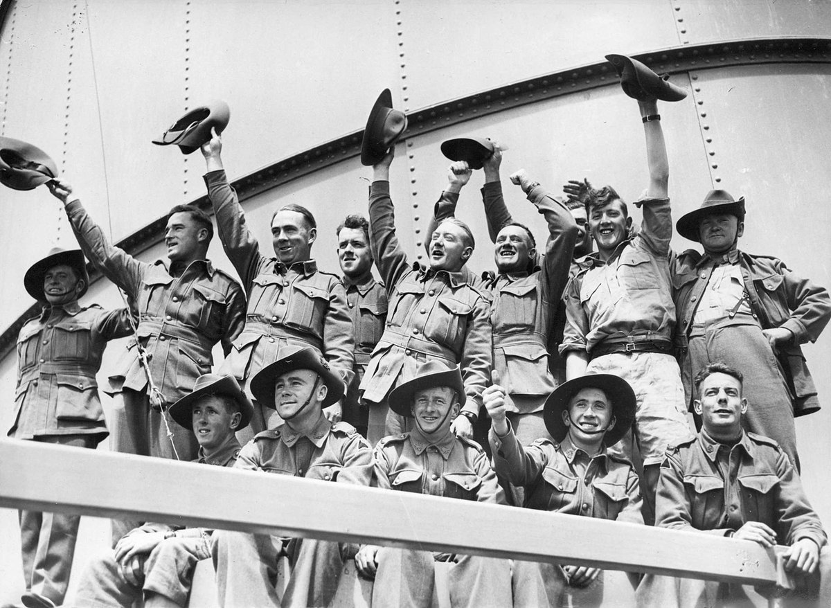 A.I.F. men waving from the ship from a high vantage point while embarking from Port Melbourne (c. 1941)
