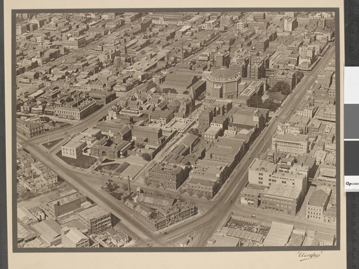View of Swanston Street and Victoria Street showing the City Baths, RMIT and the State Library, Melbourne City (1927–28)