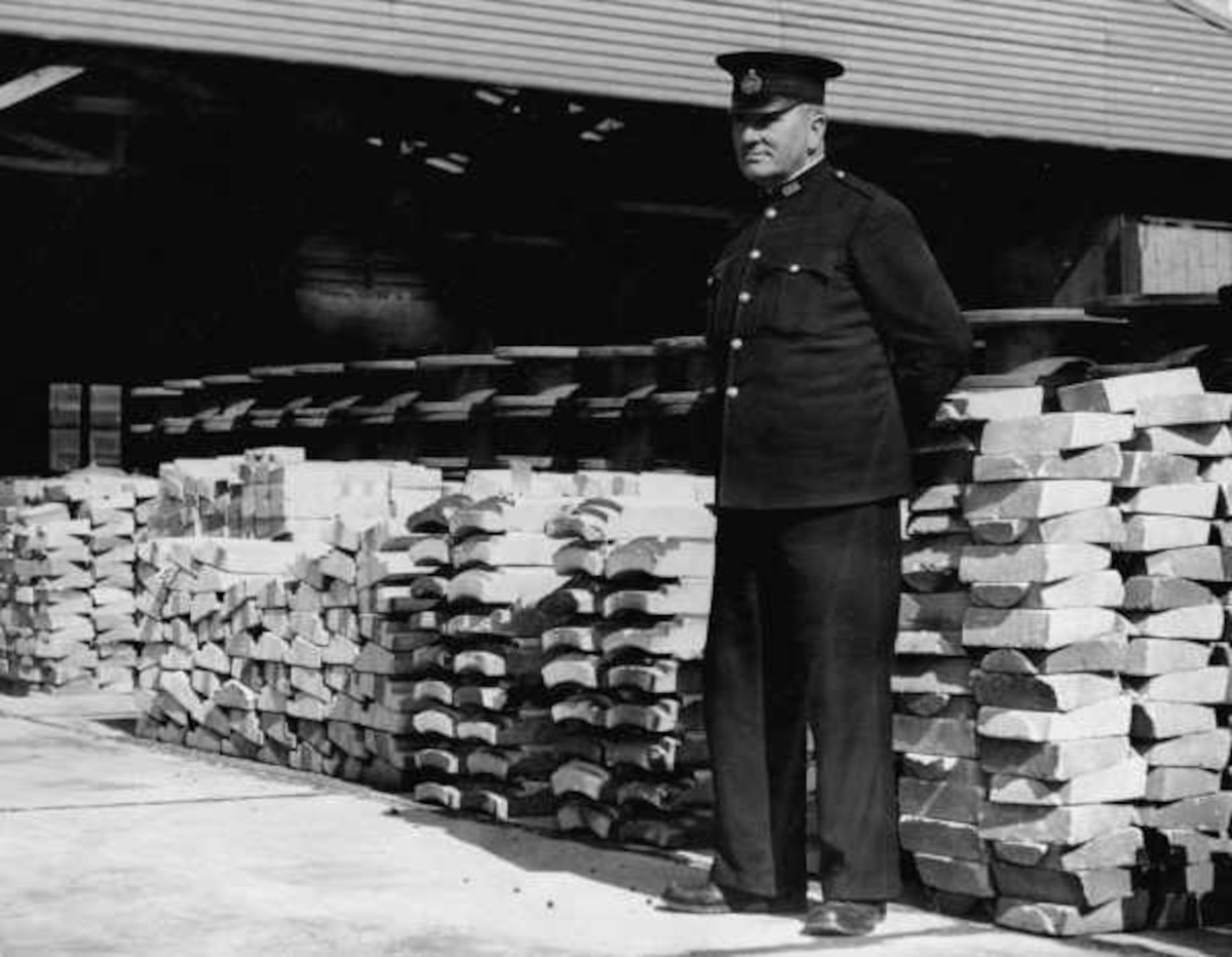 Peace Officers guard goods - firebricks - at Maribyrnong Depot [prior to Commonwealth Disposal Commission auction to be held 23rd August, 1945] (c. 1945)