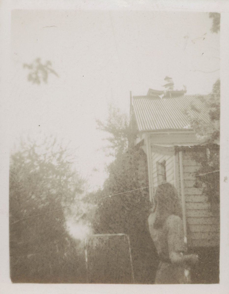 John Perceval painting on the roof watched by Mary Boyd, Open Country, Murrumbeena (1939–45)