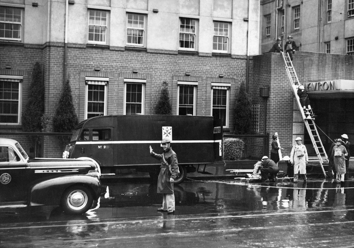 Traffic was held up and ordered to detour when a huge crater was blown, theoretically, in Commercial Rd. Prahran (c. 1942)