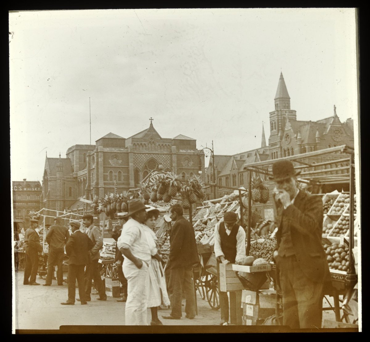 Fruit sellers and fruit carts near the corner of Flinders Street and Princes Bridge, Melbourne, Melbourne City (1900–26)