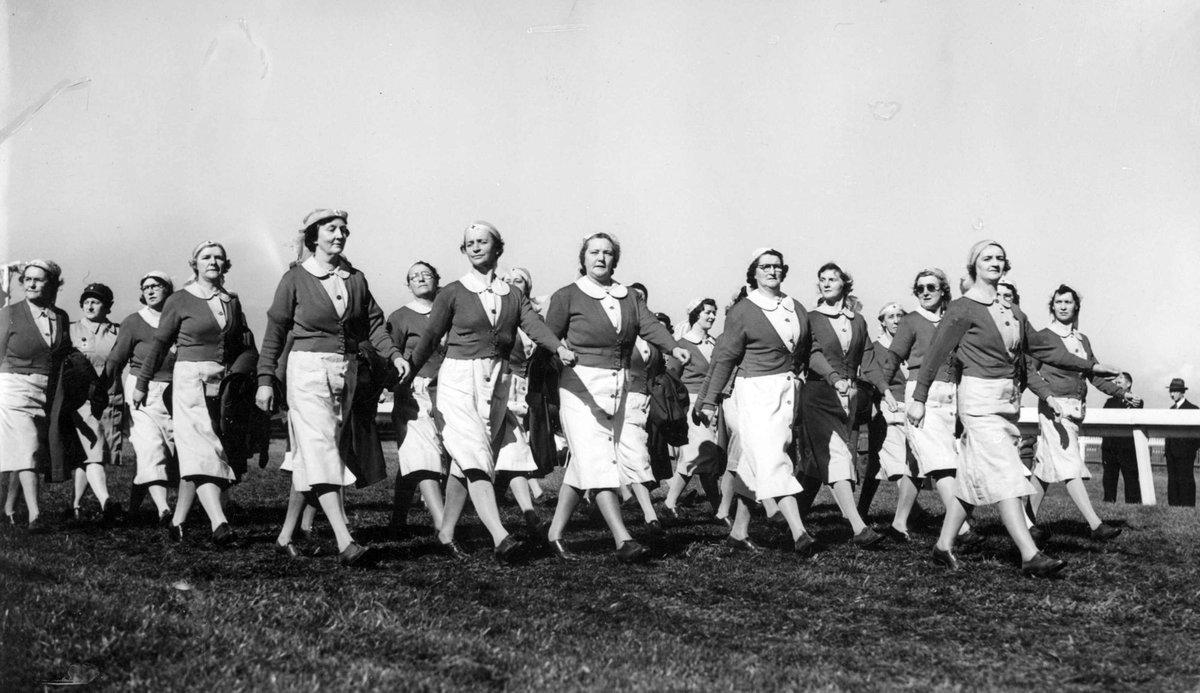 Women marching at A.R.P. i.e. Air Raid Precautions display, Flemington racetrack (c. 1943)