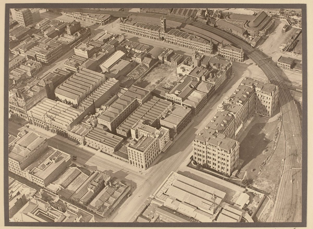 Intersection of Flinders and Spencer Streets, showing the Spencer Street Railway Building and the old Fish Market, Melbourne City (1927–28)