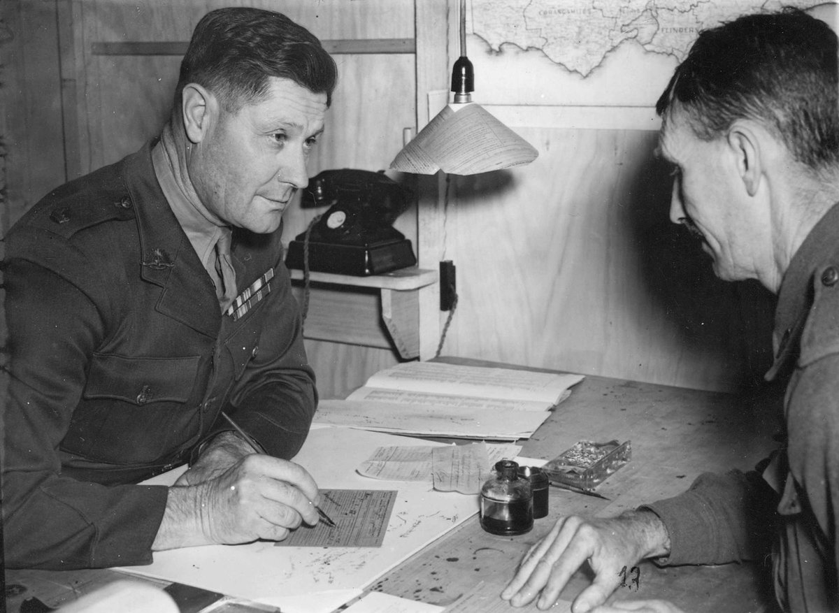 Maj. Schofield M.M. M.C., Officer in charge, interviews Dvr. E.J. Steavens of Albury at the new army rehabilitation centre at Caulfield (c. 1943)