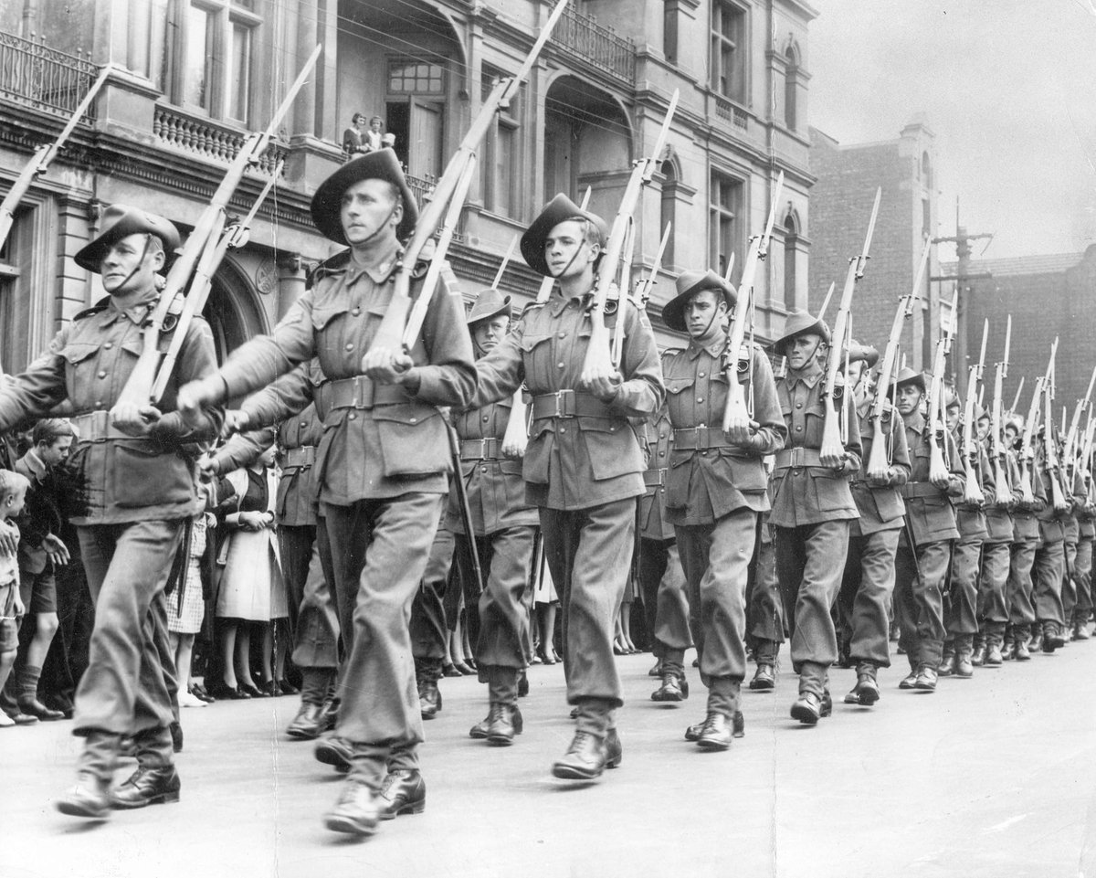 Looking up at 2nd A.I.F. marching through Melbourne street (1939–44)