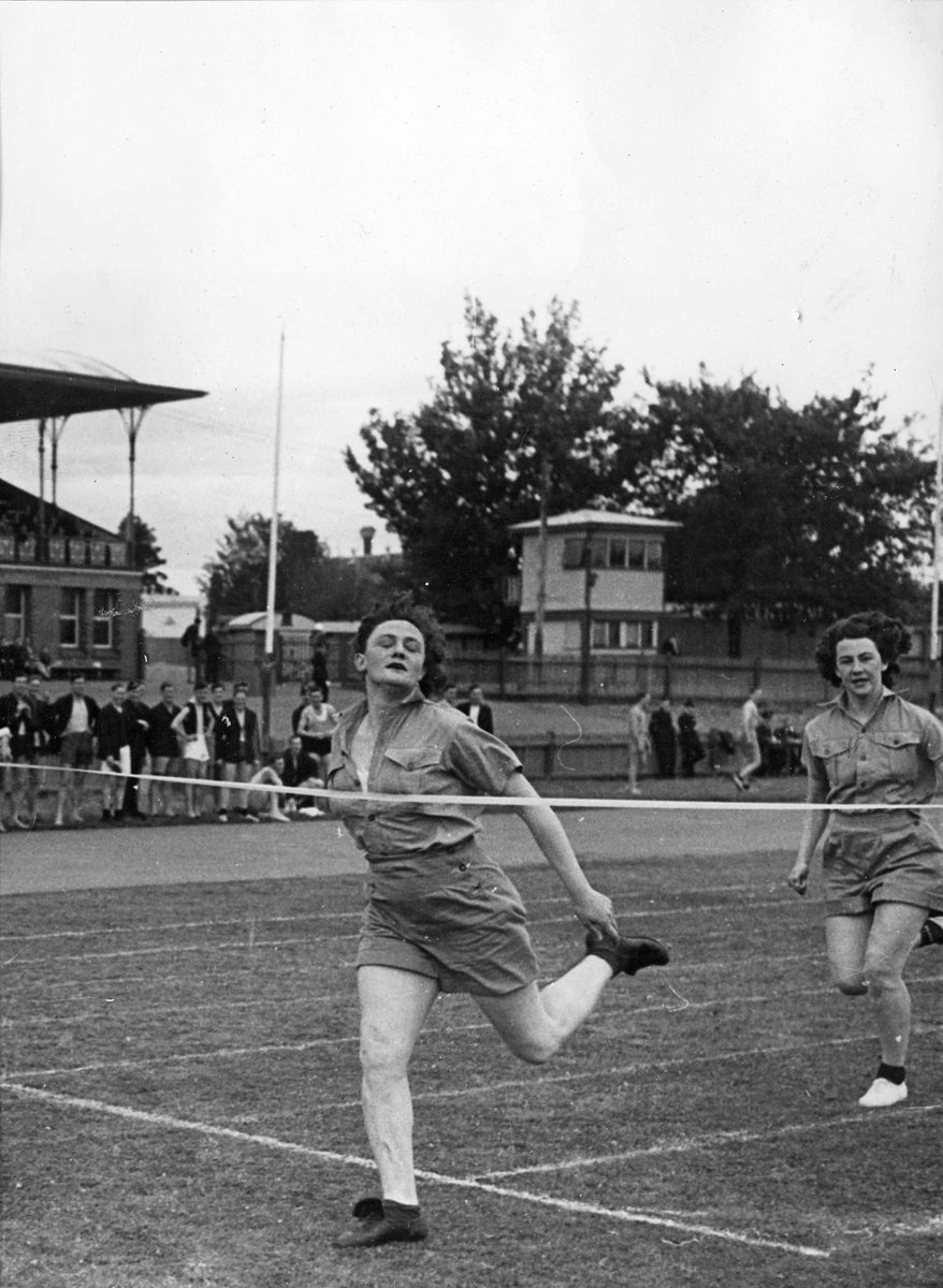 W.A.A.F.'s 100 yards Championship Final: Sergeant Joyce Campbell of Canterbury winning from A.C.W. Vera Griggs of Brighton in 13 secs (c. 1944)