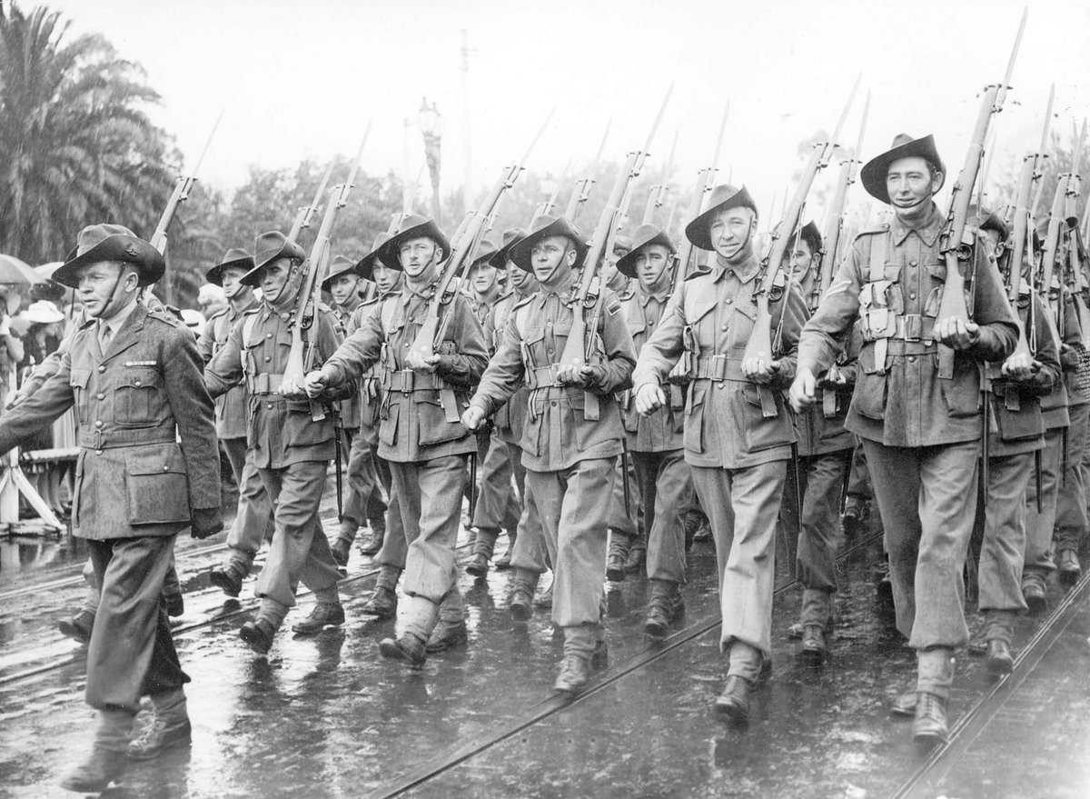 Australian servicemen marching down Swanston Street, past the saluting base at the Melbourne Town Hall, Melbourne City (1940–45)