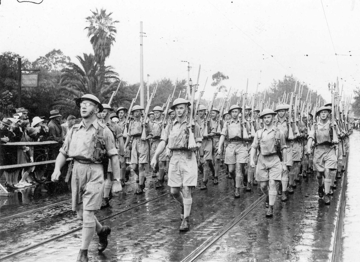 Australian servicemen marching down Swanston Street, past the saluting base at the Melbourne Town Hall, Melbourne City (1940–45)