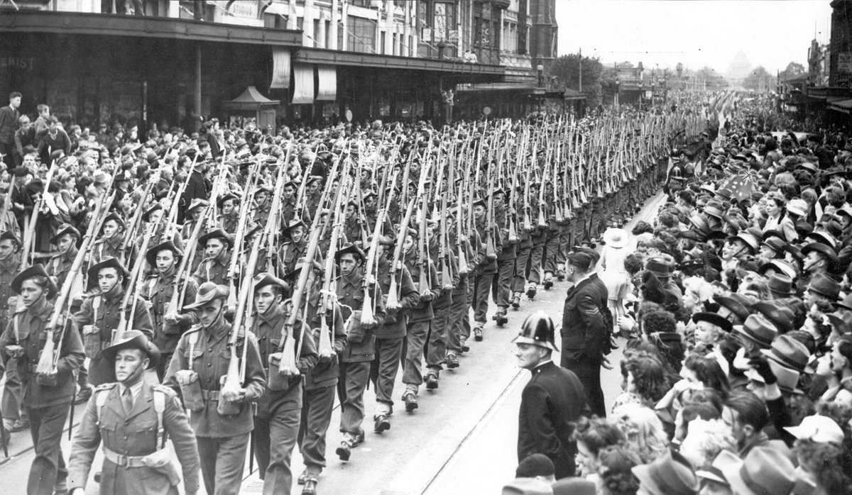 4th and 15th Infantry Brigades march up Swanston Street past Flinders Lane corner, Melbourne City (1941–47)