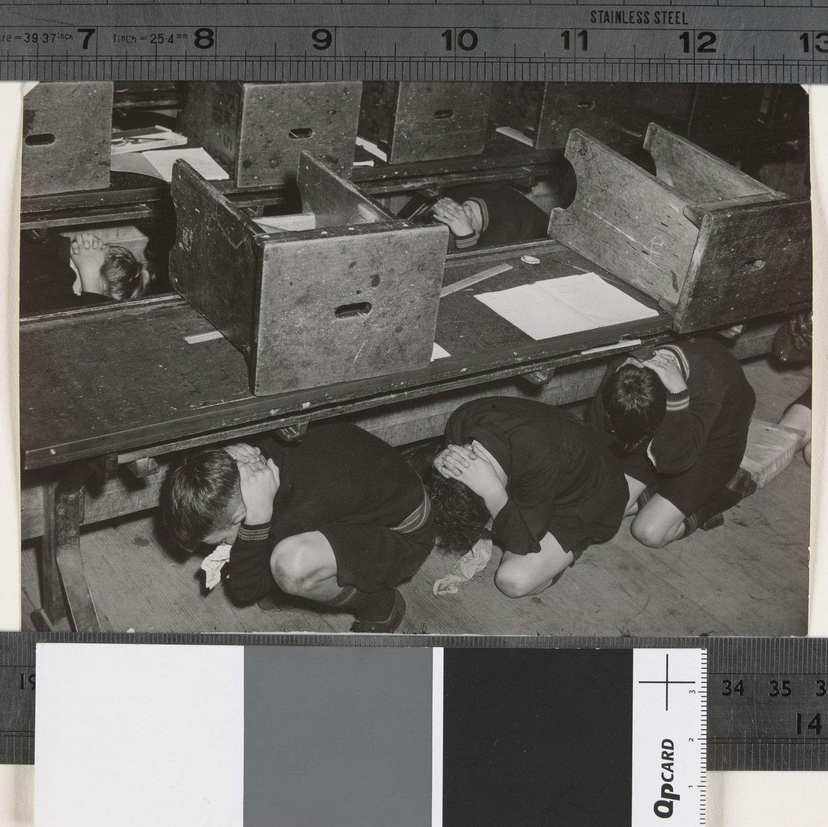 Brighton Tech boys take cover under their desks (c. 1942)