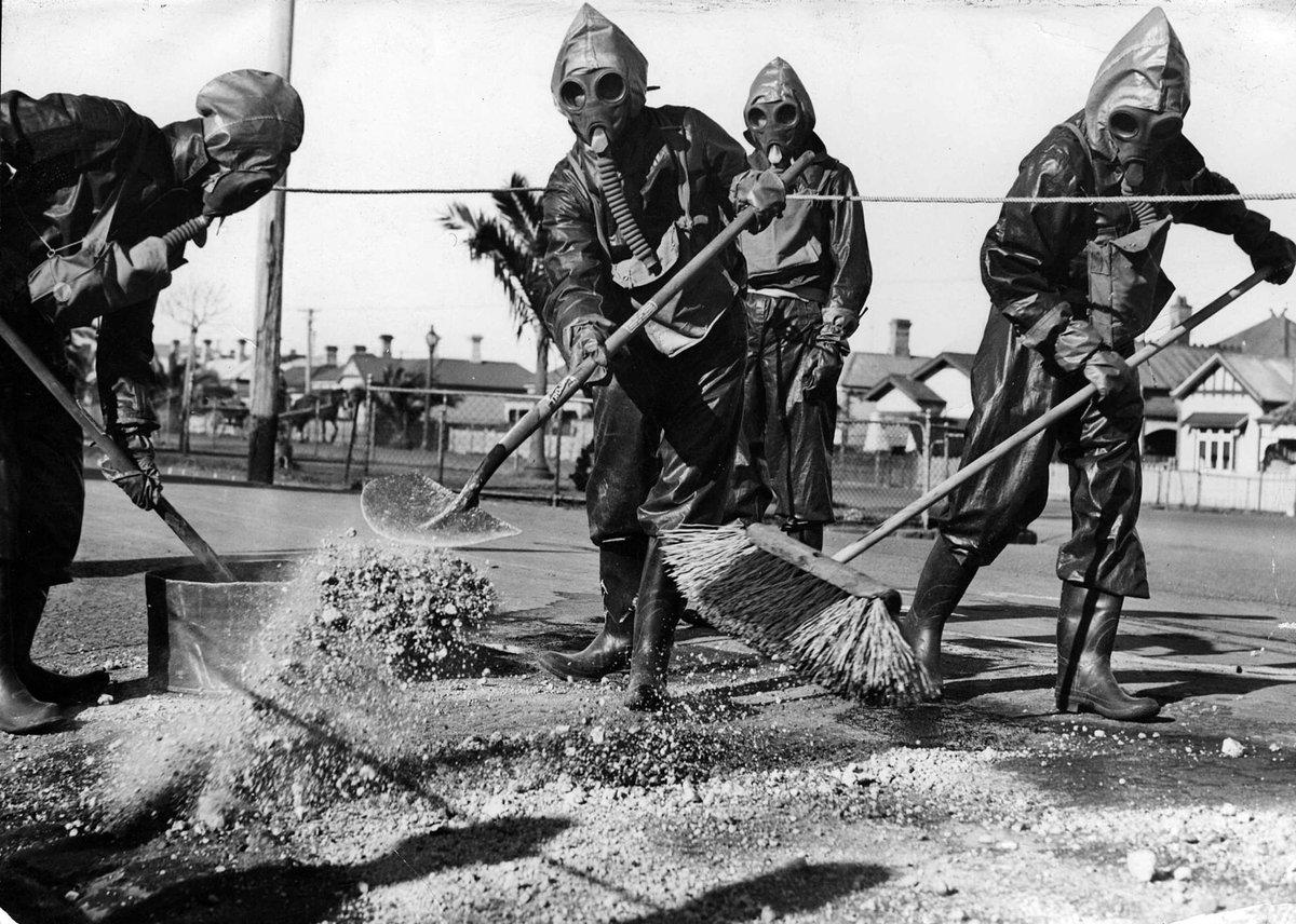 Footscray Council Decontamination Squad clear sand or gravel within roped off area (c. 1940)