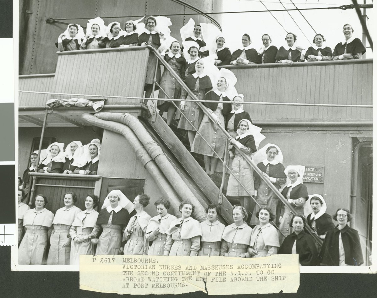 Melbourne. Victorian nurses and masseuses accompanying the second contingent of the A.I.F. to go abroad watching the men file aboard the ship at Port Melbourne (1940?)
