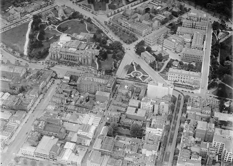 Top end of Collins and Bourke Streets, Melbourne, showing Parliament House and section of East Melbourne, 1930–35