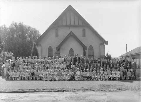 Large group of men, women and children outside Church of Christ, Berry Street, North Essendon, 1951?