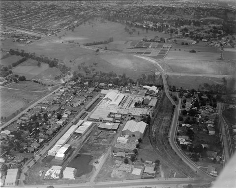 Paper mill at Fairfield with chimney with APPCo on it in centre of image, c. 1938