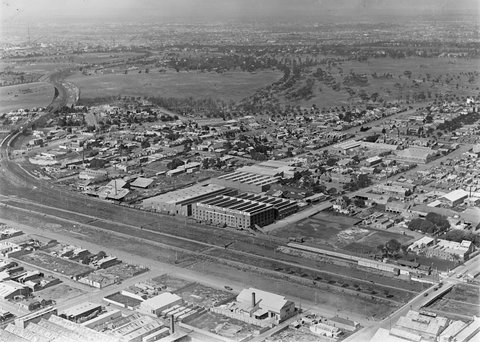 Flemington looking towards Parkville with O'Connell & Kerr's engineering works in Stubbs Street l.c. and Victorian Cooperative Co Ltd in centre of image, 1925–40