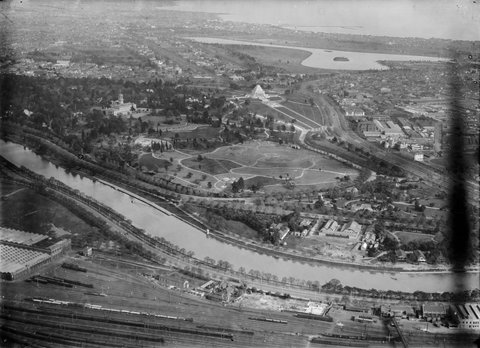 Looking from railway lines over Botanic Gardens, Shrine of Remembrance and Albert Park Lake to Port Phillip Bay, 1925–40