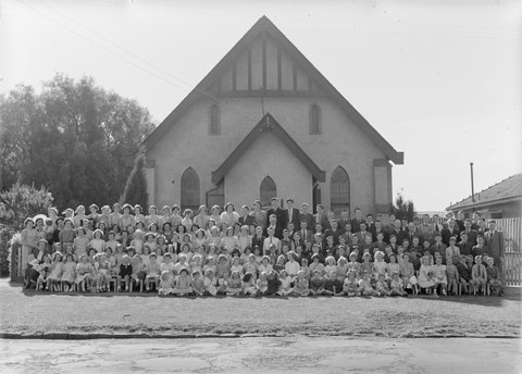 Large group of men, women and children outside Church of Christ, Berry Street, North Essendon, 1951?