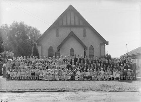 Large group of men, women and children outside Church of Christ, Berry Street, North Essendon, 1951?