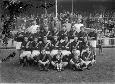 Richmond football team in front of a grandstand, 1920–50