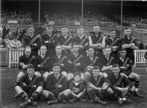 Richmond football team in front of a grandstand, 1934–35