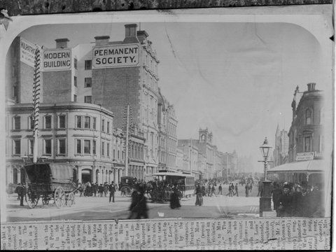 Intersection of Collins and Elizabeth Streets, showing the Premier Building Society, the Union Bank, Fanny Edel, cable tram, horse drawn vehicles and pedestrians, 1910–20