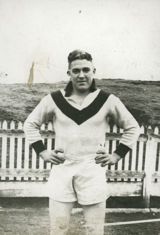 Two South Melbourne football players, Eddie Lane and an unidentified player, standing on field, 1951–54