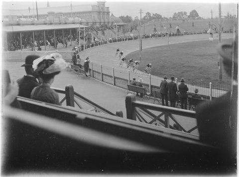 Bicycle race viewed from stand, Exhibition Oval, Melbourne, c. 1910