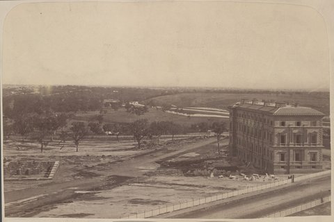 Police Reserve, Jolimont, showing the new Treasury Building being erected East Melbourne, 1872