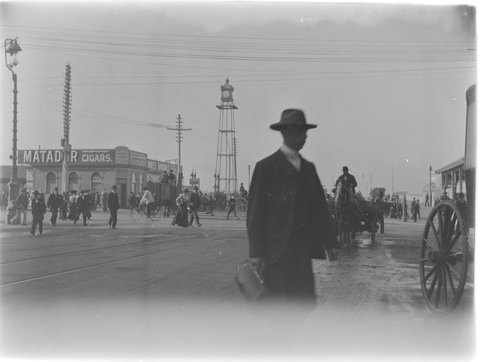 Swanston Street looking South from Flinders Lane showing Princes Bridge railway station with clock tower, c. 1910