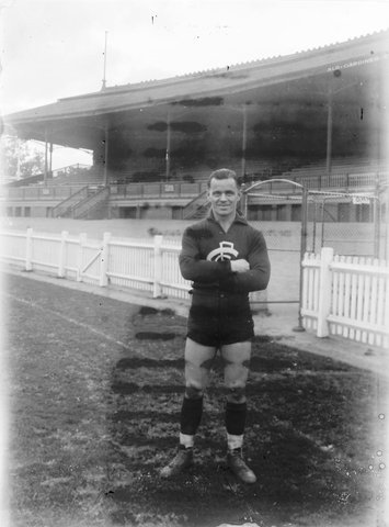 Carlton Football player Herb "Stumpy" Turner, in front of a grandstand, 1944–49