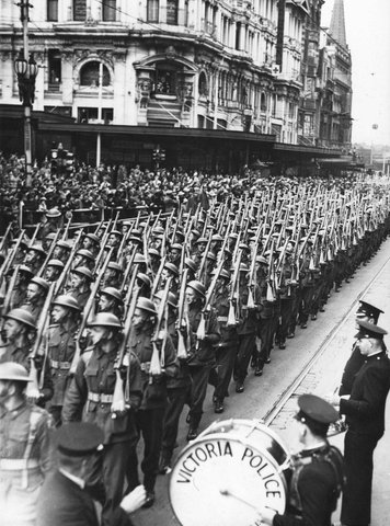 Soldiers marching up Swanston Street past the Police Band, 1939–45