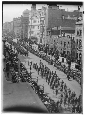[Crowds watching soldier's marching down street for Royal Visit, Melbourne], c. 1901