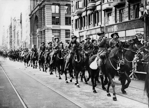 "Eyes Right" as Light Horse pass saluting base in Collins St, c. 1941