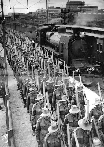 Australian troops on a railway platform, train on the track behind them, Platform 10A, Spencer Street Station, Melbourne, c. 1944