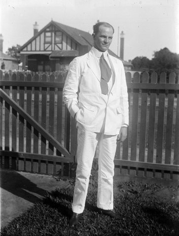 Reg? Waugh [in light tropical suit (hatless) on couch lawn in front of picket fence] at 12 Alexandra Rd. Elsternwick, 1900–15
