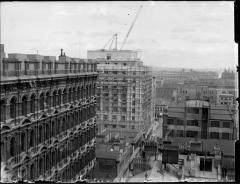 Port Authority building being built, looking down Flinders Lane to Spencer Street from the rear roof of 395 Collins Street (Goode House) on the corner or Collins and Queens Streets, Melbourne, c. 1929