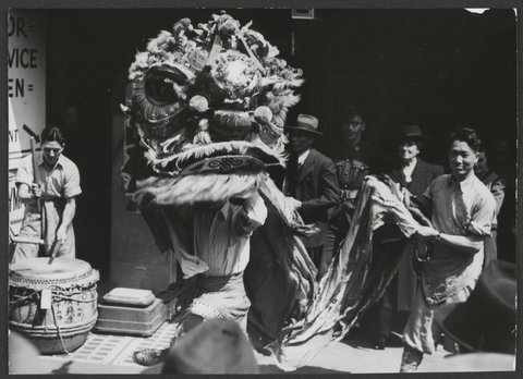 Chinese lion and drays in city of Melbourne to promote the Chinese Lion Carnival, c. 1943