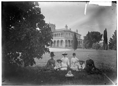 Four women and two children seated on the lawn in front of Stony Park, East Brunswick, 1880–1900