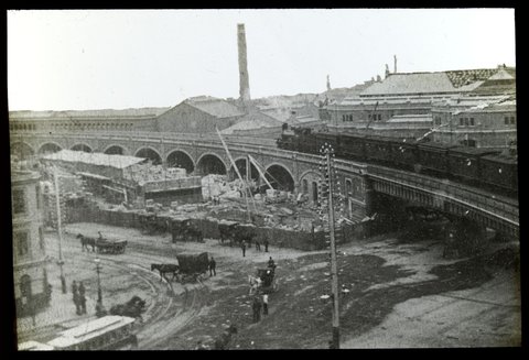 [Train on a bridge in Melbourne, over Flinders and Spencer Streets intersection], 1890–1910