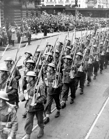 Australian Troops with eyes right march past Melbourne Town Hall, 1942–43